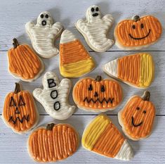 decorated halloween cookies arranged in the shape of pumpkins