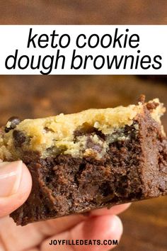 a hand holding a chocolate cookie dough brownie with the words keto cookie dough on it