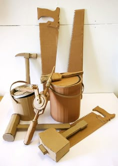 several different types of woodworking tools sitting on a table next to some cardboard boxes