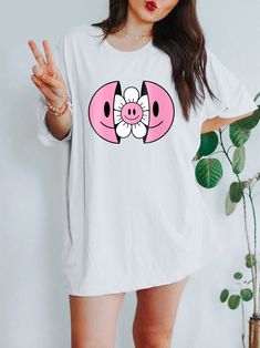 Get ready to be OBSESSED with your new Smiley Face Flower t-shirt. It's the coolest and most comfortable way to show off the latest styles. Also makes a great gift! LOOKING FOR THE HOODIE? ► https://www.etsy.com/listing/1181527971 * PRODUCT DETAILS * ↠ High Quality, Super Soft & comfy Bella + Canvas T-Shirt ↠ 100% pre-shrunk cotton (heather colors are a poly-cotton blend) ↠ This is a direct-to-garment print, no vinyl or stencils. Which means it will last a lot longer! ↠ Printed in and Shipped fr Oversized T Shirt Aesthetic, Smiley Face Tshirt, Face Flower, T Shirt Aesthetic, Aesthetic Shirt, Smiley Faces, Aesthetic Shirts, Trendy Shirts, Off White Color