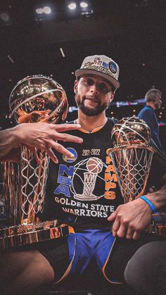 the golden state warriors'stephen curry is surrounded by his trophies after winning the title