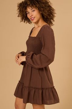 This babydoll dress features a flattering fit and flare silhouette. The long sleeves add a touch of sophistication, making it perfect for both casual and special occasions. White Dress Skirt, Football Dress, Long Sleeve Babydoll Dress, Skirts With Boots, Altar'd State, Family Outfits, Babydoll Dress, Dress With Bow, Dress With Boots