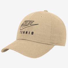 a tan hat with the word tennis printed on it and a nike logo in black