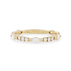 a yellow gold band with five round diamonds