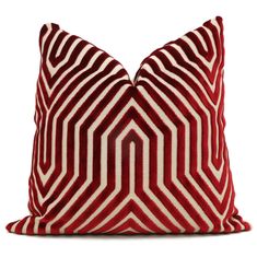 a red and white striped pillow on a white background