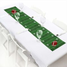 a football field table runner with glasses on it