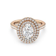 a rose gold engagement ring with an oval center surrounded by round brilliant diamond halos