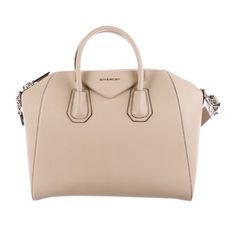 Cream Grained Leather, Silver Toned Hardware, Khaki Canvas Lining, Shoulder Strap. Handle Drop 3” Width 14” Shoulder Strap Drop 12” Depth 12” Height 10” Givenchy Bags, Givenchy Antigona, Givenchy Bag, Leather Silver, Leather Handbag, Givenchy, Leather Handbags, Shoulder Strap, Bag Lady