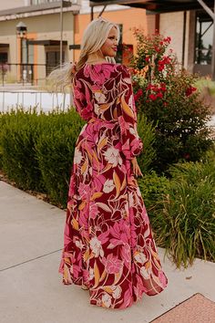 - Go wine tasting in this fabulous maxi! Its flowy silhouette and feminine floral print give it romantic energy, making it a perfect option for taking in scenic vineyard views with your sweetheart. Wrap yourself in chic style with this gorgeous dress! - Airy chiffon material with an abstract floral print featuring pink, latte, cream, and different orange hues - A v-cut neckline - A built-in bodice and skirt lining - Long, sheer sleeves with elastic cuffs - A wrap style front that loops through a Romantic Energy, Pink Latte, Skirt Lining, Orange Hues, Faux Leather Purse, Wrap Maxi Dress, Abstract Floral Print, Chiffon Material, Maxi Wrap Dress