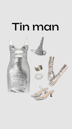 a woman's silver dress and shoes with the words tin man on it in black