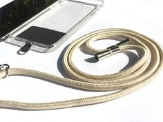 a cell phone is connected to a charger with a cord that leads to it