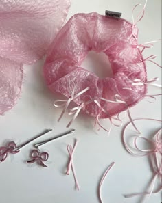 some pink items are laying out on the table