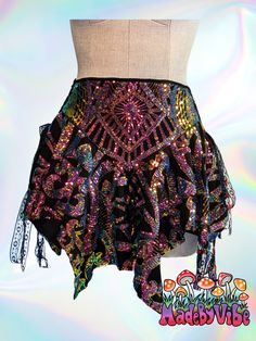 Add a touch of magic to your look with this enchanting fairy skirt. With adjustable lace-up sides and a high-cut waist, it offers the perfect fit that flatters every time. Made with sequin fabric, lined with polyester spandex and broadcloth, it's ideal for raves, festivals, cosplay outfits, and fabulous nights out. Made to Order Fairy Grunge Fitted Skirt For Festivals, Fairy Grunge Mini Skirt For Festival, Fairy Grunge Mini Skirt For Party, Festival Fitted Sequin Mini Skirt, Festival Mini Skirt With Sequins, Festival Fitted Mini Skirt With Sequins, Bohemian Fitted Wrap Skirt For Party, Velvet Swimwear, Fairy Skirt