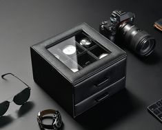 Introducing Our Personalized Men's Valet Box with Watch Display: Organize his accessories in style with our Personalized Men's Valet Box. This compact and practical organizer features two drawers with an acrylic top, providing ample storage space for his watch collection, cufflinks, rings, and other essentials. With its sleek design and thoughtful details, it's the perfect addition to any dresser or nightstand. ▷ COMPACT AND STYLISH: Crafted with a compact design, our valet box offers a stylish Classic Formal Watch Accessories With Gift Box, Watch Box For Men, Mens Valet, Mens Watch Box, Watch Cufflinks, Ring Storage, Watch Display, Watch Box, Watch Collection