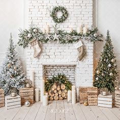 a fireplace decorated with christmas trees and candles