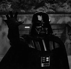 darth vader waving at the camera with his hand up in front of him