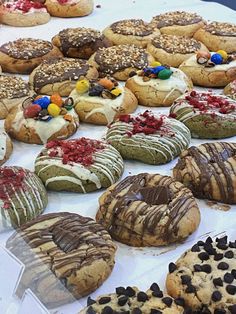 many different kinds of donuts are on display