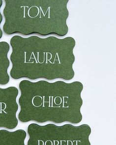 green name tags with white writing on them