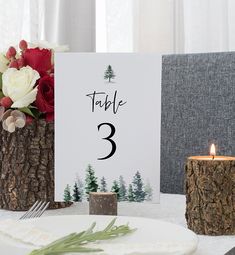 the table numbers are placed on wood logs