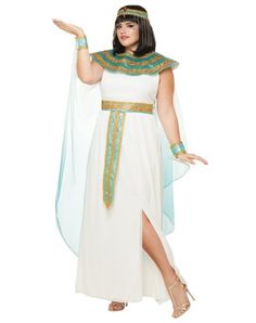 an egyptian woman wearing a white dress and gold trimmings, with her hands in the air