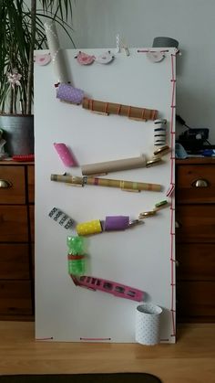 a white refrigerator with toothbrushes and other items on it