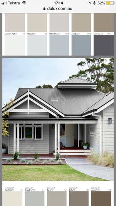 a gray house with white trim and grey roofing is featured in the color scheme