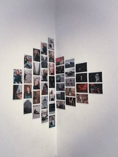 a white wall with many pictures hanging on it's side and the bottom half is covered in photos