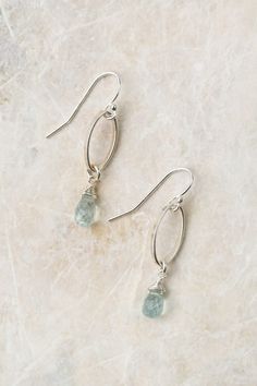 Experience the beauty of these exquisite earrings featuring a sterling silver wire wrapped aquamarine birthstone. Perfect for those born in March! Sterling Silver (lead and nickel free) Aquamarine On sterling silver ear wires We hand select our natural materials, thus there may be slight variations in color and/or size that will not detract from the overall aesthetic Our unique handcrafted designer jewelry for women is made in America, with each design created individually in our personal design Minimalist Silver Earrings For May Birthstone, Silver Aquamarine Gemstone Earrings, Silver Aquamarine Dangle Earrings, Nickel Free Blue Topaz Drop Earrings, Aquamarine Dangle Earrings With Ear Wire, Aquamarine Drop Earrings With Ear Wire, Delicate Sterling Silver Birthstone Earrings, Delicate Silver Birthstone Earrings, Silver Briolette Earrings With Birthstone