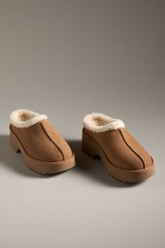 Suede upper Upcycled wool, lyocell insole EVA sole Slip-on styling Imported | New Heights Cozy Clogs by UGG in Beige, Women's, Size: 5, Wool/Lyocell/EVA at Anthropologie Winter Suede Clogs With Textured Footbed, Winter Closed Toe Clogs With Textured Footbed, Comfortable Winter Clogs With Textured Footbed, Comfortable Winter Clogs With Textured Sole, Cozy Slip-on Clogs With Textured Footbed, Winter Slip-on Clogs With Leather Footbed, Comfortable Clogs With Textured Footbed For Winter, Winter Beige Closed Toe Clogs, Winter Leather Footbed Slip-on Clogs