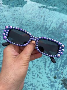 90's retro black sunglasses with blue iridescent pearls covering the front of the frames. Central Cee, Custom Sunglasses, Iridescent Pearl, Star Darlings, Retro 90s, Black Sunglasses, Blue And Black, Eyewear Sunglasses, Party Favor