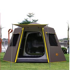 a tent with the door open on grass