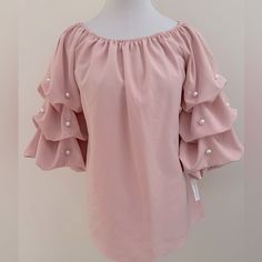 3/4” Puffy Ruched Sleeves Off Shoulder Top Elastic Detail On Shoulder And Sleeve Pearl Accents On Sleeves Laying Flat: - 18” Pit-Pit - 21.5” Length Bin# 10 Bag# 1-0356 Trendy Pink Top With 3/4 Sleeves, Trendy Pink Tops With 3/4 Sleeve, Pink Half Sleeve Blouse For Summer, Pink Half Sleeve Summer Blouse, Chic Pink Half Sleeve Tops, Pink Half-sleeve Tops For Spring, Pink Half Sleeve Tops For Spring, Chic Pink Half-sleeve Blouse, Chic Pink Half Sleeve Blouse