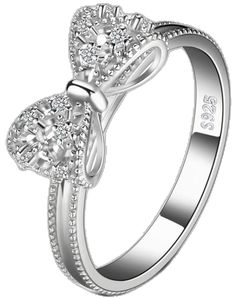 a white gold ring with two heart shaped diamonds