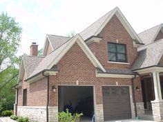 a brick house with an attached garage