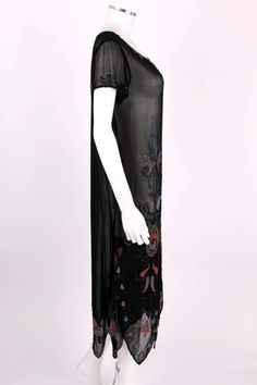 For Sale on 1stDibs - Vintage Couture c.1920's black silk georgette beaded flapper dress. Multicolor floral glass beaded embellishment along front, hemline, neckline, and cuffs. Black Beaded Fringe Flapper Dress, Black Sequined Art Deco Flapper Dress, Black Art Deco Flapper Dress With Sequins, Black Gatsby Style Embellished Dress, Black Art Deco Flapper Dress For Evening, 1920s Fitted Black Flapper Dress, Black Art Deco Flapper Dress, 1920s Black Flapper Dress For Cocktail, Vintage Black Flapper Dress With Beaded Fringe