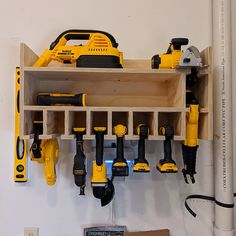 a bunch of tools hanging on a wall