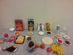 a table topped with lots of food and condiments