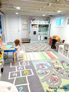 a child's playroom with toys and rugs on the floor