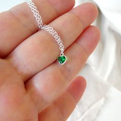 "Sterling Silver necklace with zircon emerald. Size shown is 16\". Please choose your favorite necklace length at checkout. All lengths have a one inch extender, that way you'll have some wiggle room to play with the length. For example, if you choose a 14 inches necklace length, you'll have options to close the necklace at any length between 14 inches and 15 inches. ⇒ MATERIALS Entirely made of .925 sterling silver and a zircon. ⇒ LENGTH Available in several lengths at checkout. Kindly choose y Heart Cut Emerald Necklace For Gift, Emerald Heart Charm Jewelry, Heart-shaped Emerald Jewelry For Valentine's Day, Valentine's Day Heart Shaped Emerald Jewelry, Green Emerald Heart Pendant Necklace, Heart Shaped Emerald Necklace As A Gift, Emerald Heart Pendant Necklace As A Gift, Heart-shaped Emerald Necklaces As A Gift, Heart-shaped Emerald Necklace As A Gift