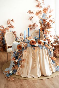 the table is decorated with flowers and candles