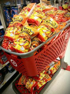 a shopping cart filled with lots of candy