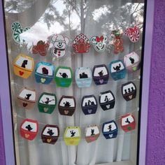 the window is decorated with mickey mouse magnets