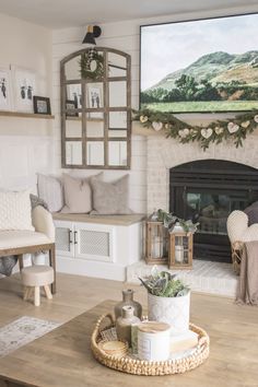 a living room filled with furniture and a fire place in front of a painting on the wall