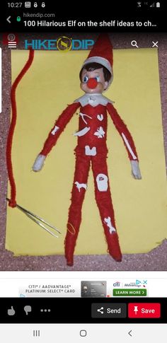 an image of a paper doll made to look like it is wearing a red and white outfit