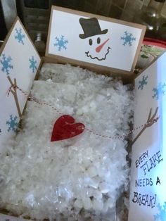 an open box filled with white rice and a red heart