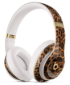 an animal print headphones with gold trimmings on the sides and white headsets