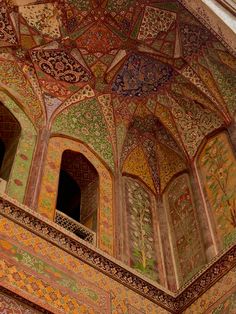 an intricately decorated ceiling in the middle of a building