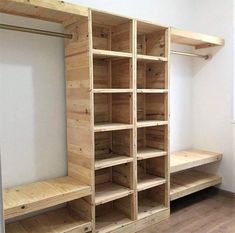 an empty room with wooden shelves and benches