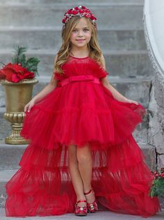 Frills for days! Our trailing tulle gown boasts a stunning design with its gathered bodice and voluminous silhouette. Finished with a satin bow waistband for an added touch of sophistication. A princess-worthy style your little one will love! High-quality fabric and craftsmanship offer a couture-like finish, so your princess can have her fashionista moment. Fully lined skirt gives her coverage, while the detachable train offers multiple style options so she can move, pose, and twirl without restriction. Perfect for formal galas, dressy events, special occasions, holiday photoshoots, and more Tulle gown with gathered bodice, detachable trailing train, and satin bow waistband Available in sizes 24MON; 3T-8Y Girls Holiday Outfit, Dress For Everyday, Gathered Bodice, Girls Special Occasion Dresses, Winter Formal Dresses, Detachable Train, Girls Boutique Clothing, Trendy Dress, Frill Dress