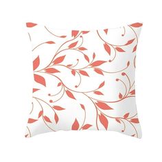 an orange and white pillow with red leaves on the front, against a white background